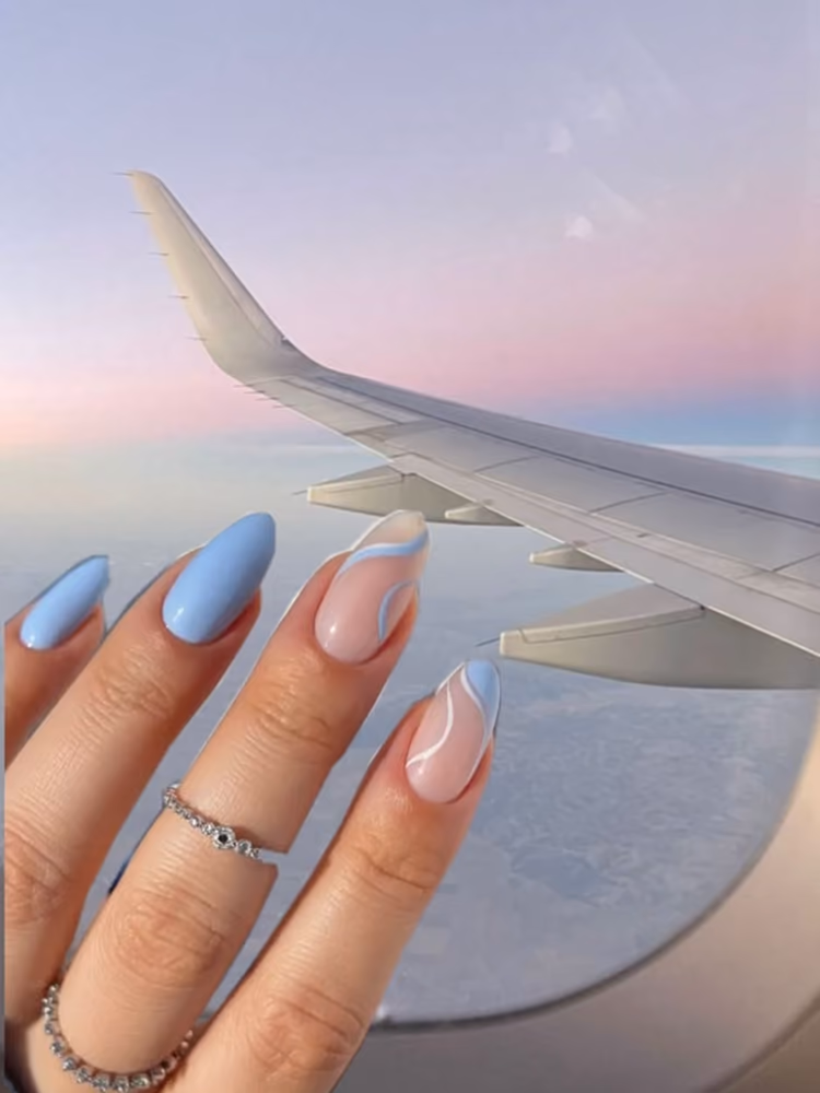 Milky pink almond nails with delicate floral sprigs