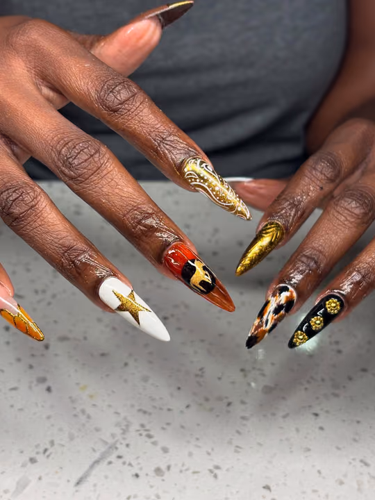 Charm Placement, Transfer Foil, Hand Painting, Stiletto — nail work by Babe Cave Beauty,LLC
